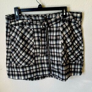 Checkered black and white skirt zip in front with belt included